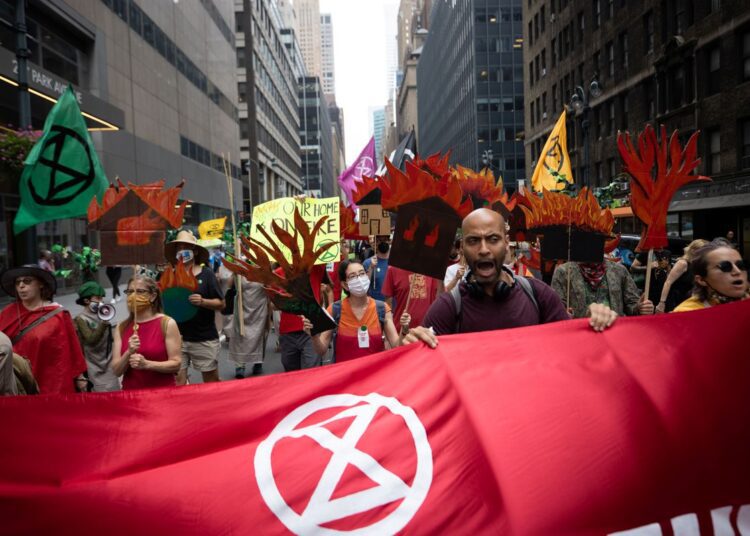 A file photo of people taking part in a 'non-violent resistance' climate change protest organized by the Extinction Rebellion in the Manhattan borough of New York City, US.