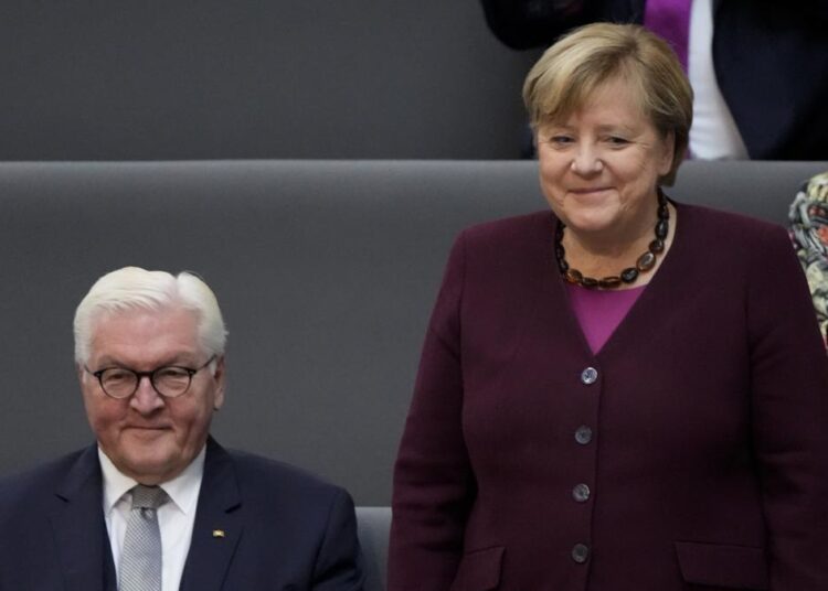 Germany’s newly elected parl’t convenes for first time 1 - Egyptian Gazette German Chancellor Angela Merkel standing next to German President Frank-Walter Steinmeier during the first plenary session of the German parliament Bundestag after the elections, Berlin, Tuesday, Oct. 26, 2021.