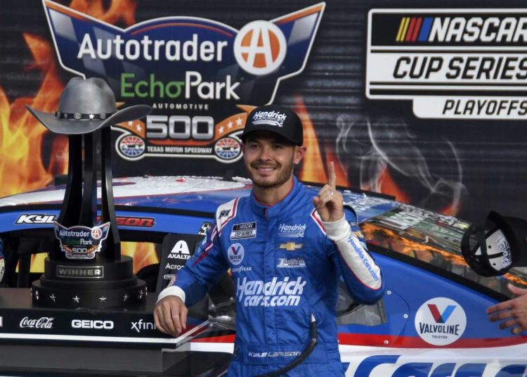 Kyle Larson (5) celebrates after winning a NASCAR Cup Series auto race at Texas Motor Speedway in Fort Worth, Texas.