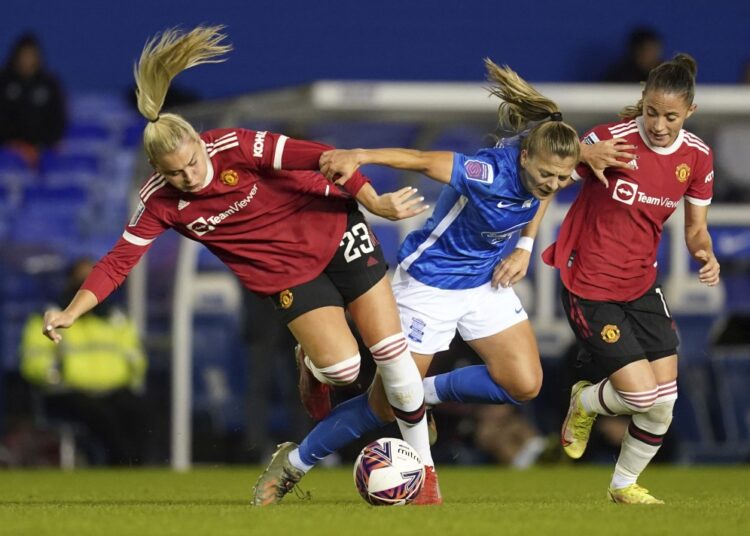 From left, Manchester United's Alessia Russo, Birmingham City's Veatriki Sarri, and Manchester United's Ona Batlle battle for the ball during the FA Women's Super League match in Birmingham, on Oct. 3, 2021.