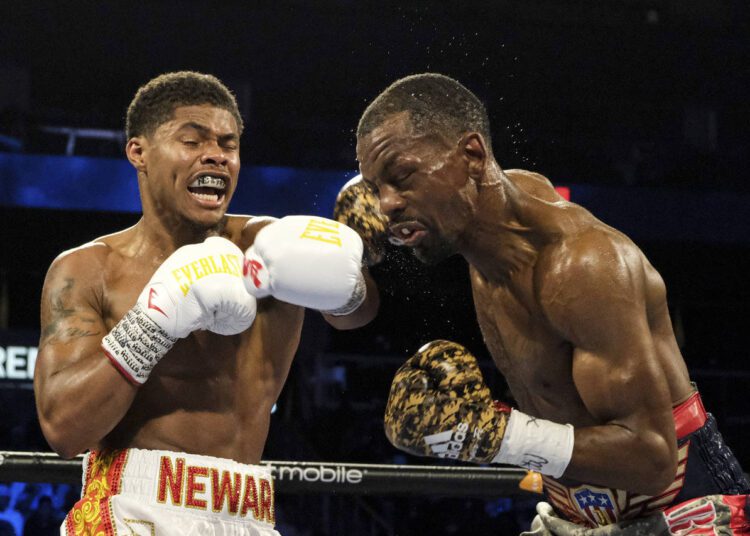 American Stevenson snatches WBO title 1 - Egyptian Gazette Shakur Stevenson (L) lands a punch to Jamel Herring during a junior lightweight boxing bout in Atlanta.
