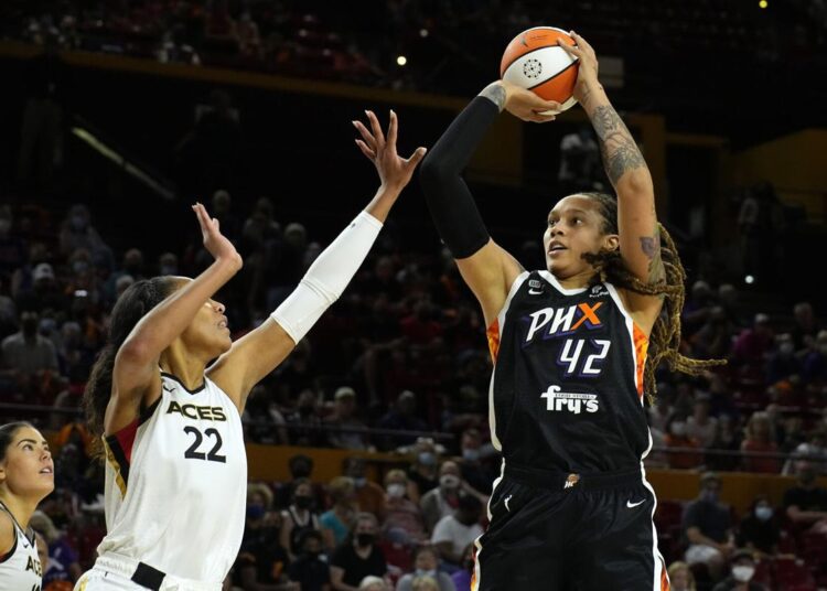 Phoenix Mercury Brittney Griner (R) shoots over Las Vegas Aces A'ja Wilson during their WNBA basketball game.