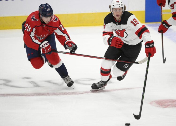Lapierre, Jarvis among the biggest surprises of NHL camps 1 - Egyptian Gazette New Jersey Devils Dawson Mercer (R) skates with the puck ahead of Washington Capitals Hendrix Lapierre during the second period of an NHL preseason game, on Sept. 29, 2021, in Washington.