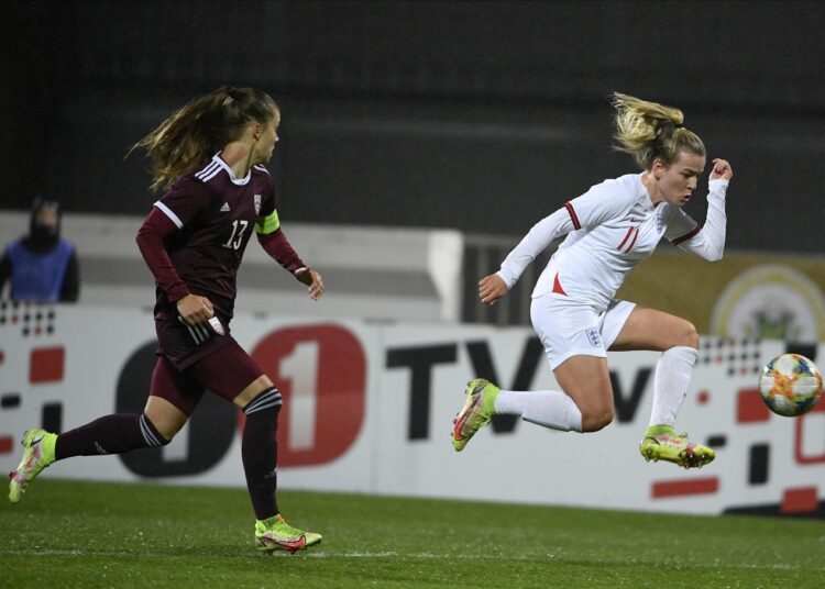 Latvia's Renete Fedotova (L) fights for the ball with England's Bethany England during the 2023 Women's World Cup Qualifying in Riga, Latvia, Tuesday, Oct. 26, 2021.