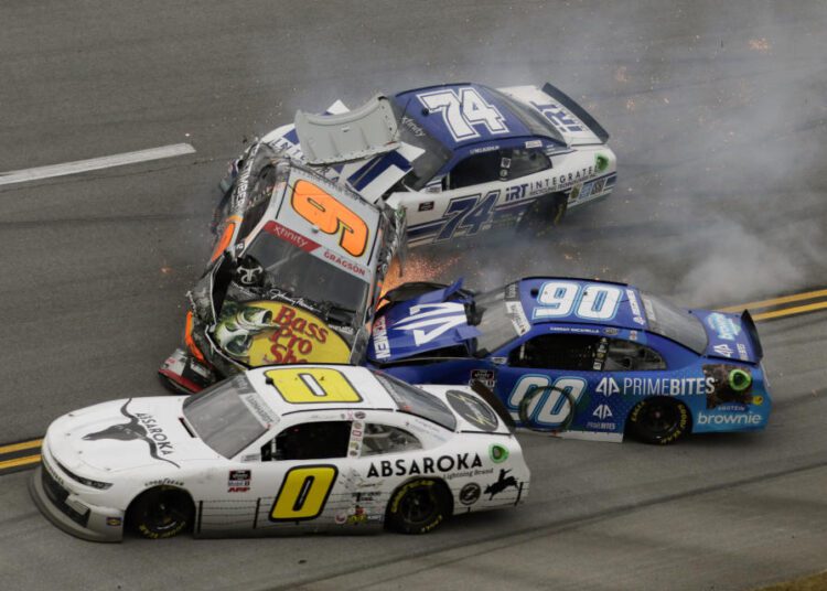 Noah Gragson (9), Caesar Bacarella (9), Jeffrey Earnhardt (0) and C.J. McLaughlin (74) tangle in a wreck during a NASCAR Xfinity Series auto race on Oct. 2, 2021, in Talladega, Alabama.
