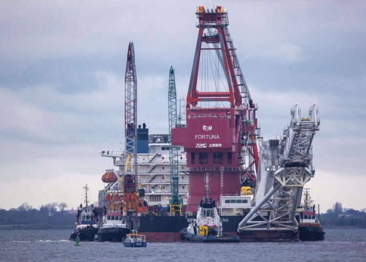 A file photo of tugboats getting into position on the Russian pipe-laying vessel "Fortuna" in the port of Wismar, Germany.