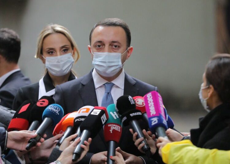 Georgia ruling party wins local election after arrest of ex-president 1 - Egyptian Gazette Georgia's Prime Minister Irakli Garibashvili speaking to the media at a polling station during the municipal elections in Tbilisi, Georgia October 2, 2021.