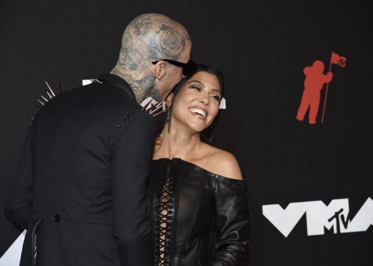 Travis Barker and Kourtney Kardashian arrive at the MTV Video Music Awards at Barclays Center on September 12, 2021, in New York.