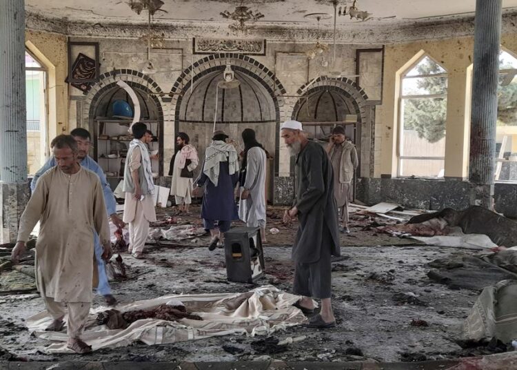 UN: 100 killed in mosque blast in northeastern Afghanistan 1 - Egyptian Gazette People view the damage inside of a mosque following a bombing in Kunduz, province northern Afghanistan, Friday, Oct. 8, 2021.