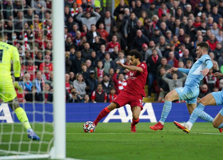 Salah shines as Liverpool and Man City battle to 2-2 draw 1 - Egyptian Gazette Liverpool’s Mohamed Salah scores his side’s second goal during the English Premier League match against Manchester City at Anfield, Liverpool.