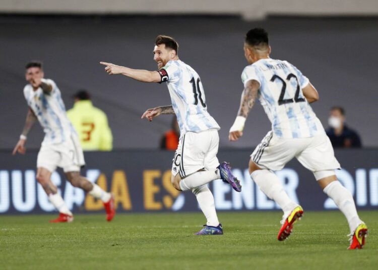Argentina's Lionel Messi celebrates scoring their first goal against Uruguay at El Monumental, Buenos Aires.