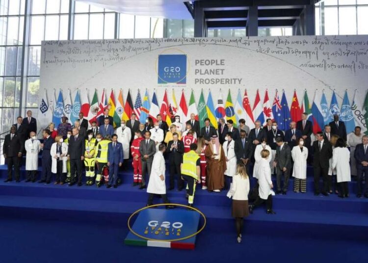 G-20 opens with call for more vaccines for poor countries 1 - Egyptian Gazette World leaders pose for a group photo at the La Nuvola conference center for the G20 summit in Rome, Saturday, Oct. 30, 2021.
