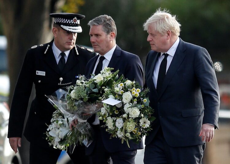 Chief Constable of Essex Police B. J. Harrington, Britain’s Labour Party leader Keir Starmer and Prime Minister Boris Johnson arrive to pay tribute at the scene where British MP David Amess was stabbed to death during a meeting.