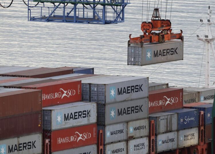 Containers are loaded onto a ship for export at Lyttelton Port near Christchurch, New Zealand, Wednesday, June 3, 2020. New Zealand is hosting this year's Asia-Pacific Economic Cooperation (APEC) forum, which culminates in a leader's meeting on Saturday, Nov. 13, 2021. Continued outbreaks of the coronavirus and related travel restrictions have confined the meeting to the virtual realm for a second straight year