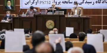 Iran publishes photos of closed hearing into plane shootdown