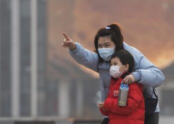 Australia confirms 2 omicron cases as travel curbs tighten