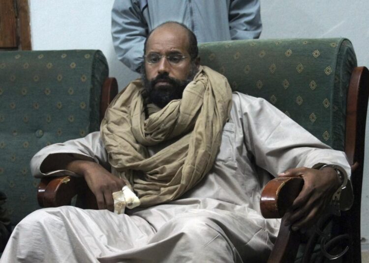 FILE - Seif al-Islam is seen after his capture in the custody of revolutionary fighters in Zintan, Libya, Nov. 19, 2011. On Sunday, Nov. 14, 2021, Libya's election agency said the son and one-time heir apparent of late Libyan dictator Moammar Gadhafi has announced his candidacy for the country’s presidential elections next month. The election agency said al-Islam submitted his candidacy papers Sunday in the southern town of Sabah. (AP Photo)