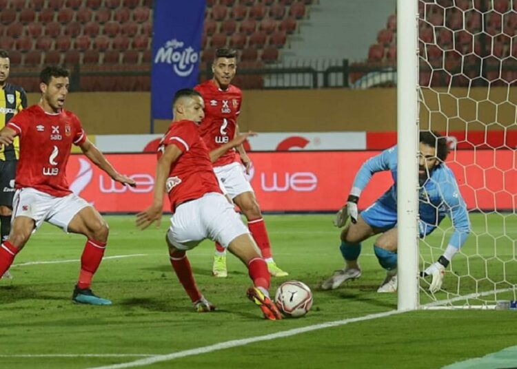 Al-Ahly’s Moroccan defender Badr Benoun (C) trying to score against Arab Contractors goalkeeper at Al-Salam Stadium in Cairo.