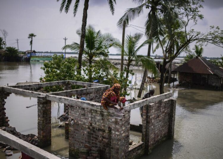 Bangladesh’s villages bear the brutal cost of climate change 1 - Egyptian Gazette Villagers collect bricks from their house that was destroyed by natural disasters at Pratap Nagar in Satkhira, Bangladesh on October 5, 2021.