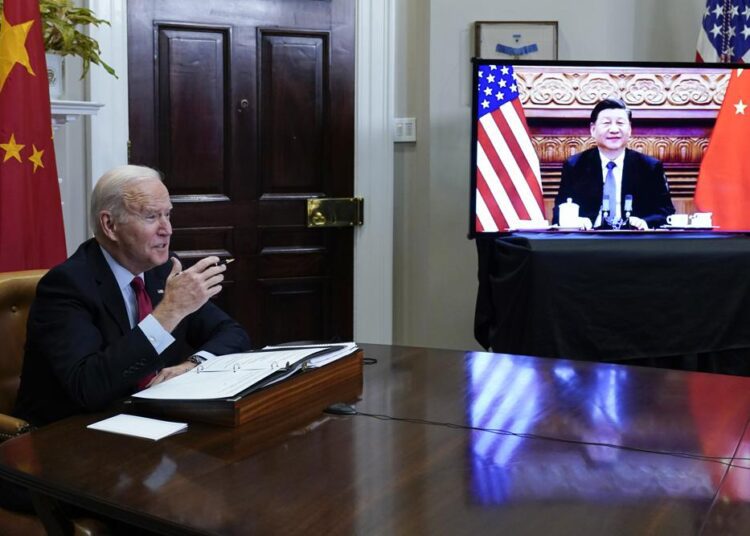 President Joe Biden meeting virtually with Chinese President Xi Jinping from the Roosevelt Room of the White House in Washington, Monday, Nov. 15, 2021.