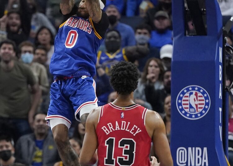 Golden State Warriors Gary Payton II dunks against Chicago Bulls Tony Bradley during their NBA game in San Francisco.
