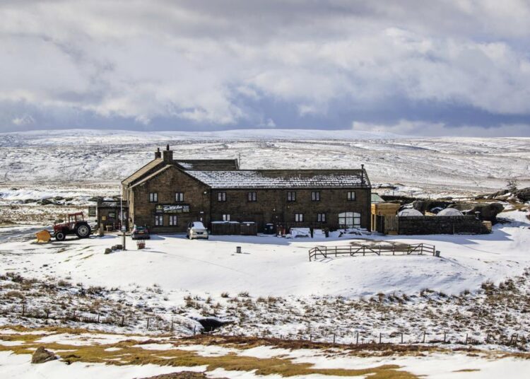 File photo showing the Tan Hill Inn, following fresh snow fall, in Richmond, Yorkshire Dales, England, March 13, 2021.