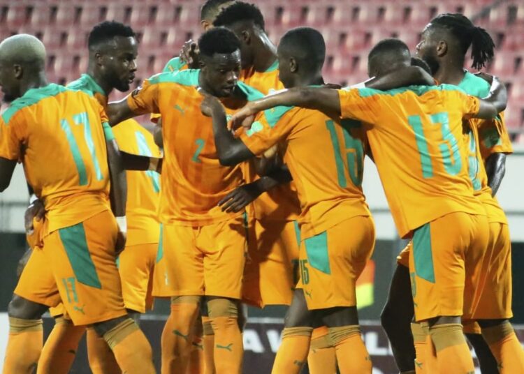 Côte d'Ivoire’s players celebrate after scoring against Mozambique to reclaim the lead of the group by a point from Cameroon.