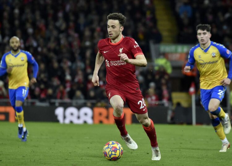 Liverpool's Diogo Jota runs with the ball during the Premier League match against Southampton at Anfield stadium, in Liverpool.