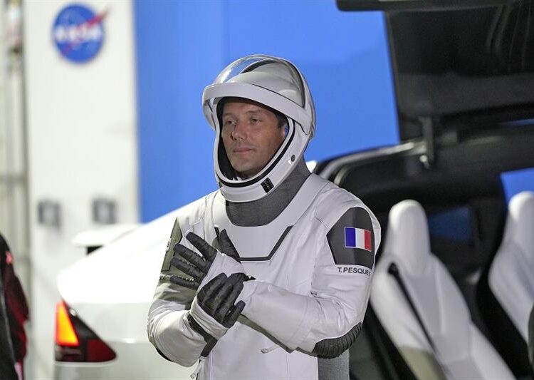 European Space Agency astronaut Thomas Pesquet of France, adjusts his glove as he talks to family and friends before a launch attempt at the Kennedy Space Center on April 23, 2021 in Cape Canaveral, Fla.