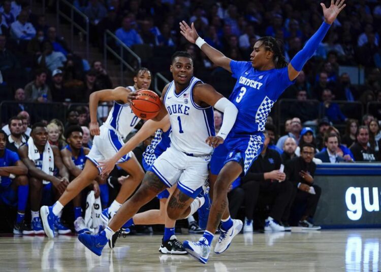 Duke's Trevor Keels (1) drives past Kentucky's TyTy Washington (3) during the first half of an NCAA college basketball game Tuesday, Nov. 9, 2021, in New York.