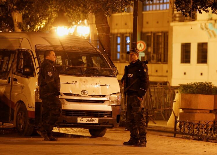 Police officers stand guard near the interior ministry in Tunis, Tunisia November 26, 2021.