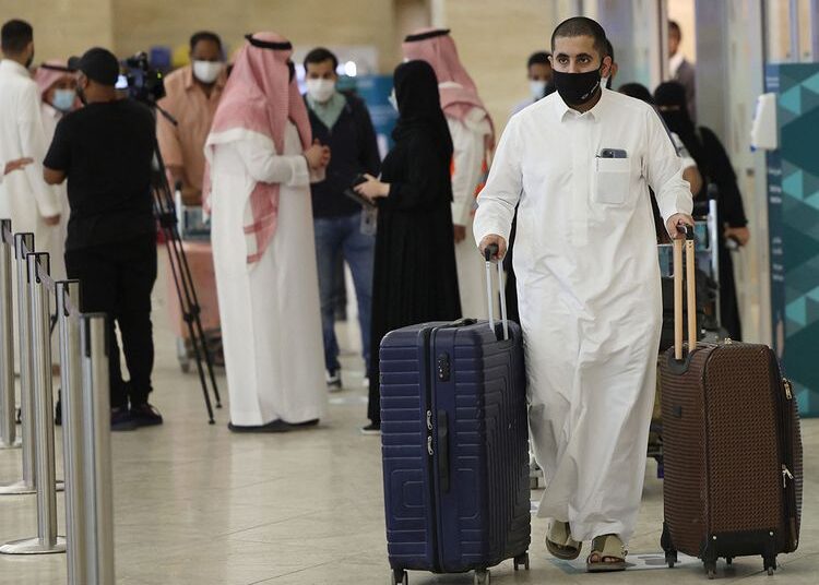 A file photo shows Saudi passengers arrive to King Khaled International airport in the capital Riyadh.