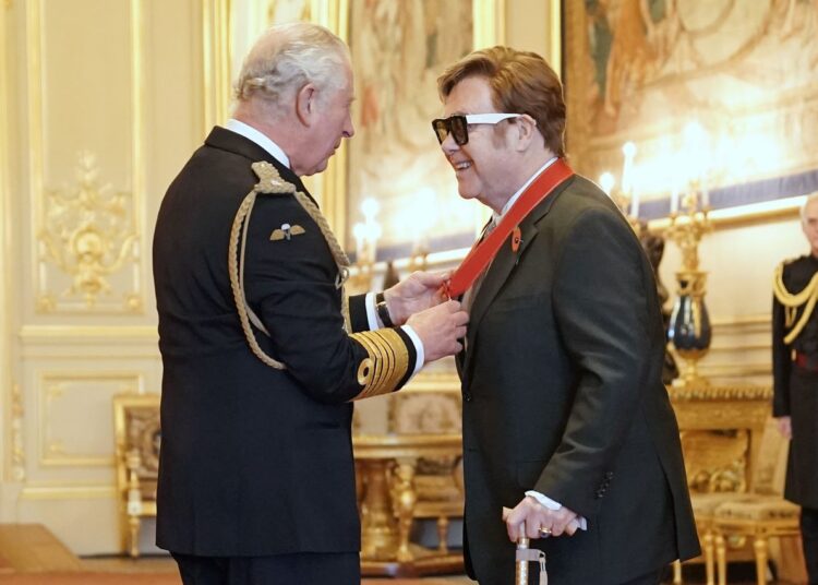 Sir Elton John is made a member of the Order of the Companions of Honour by Prince Charles during an investiture ceremony at Windsor Castle, in Windsor, England.