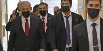 Netanyahu appears in court as ex-aide prepares to take stand