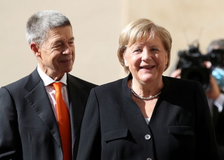German Chancellor Angela Merkel and her husband Joachim Sauer arrive ahead of a meeting with Pope Francis at the Vatican October 7, 2021.