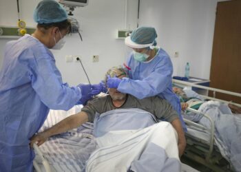 As virus surges in Eastern Europe, leaders slow to act