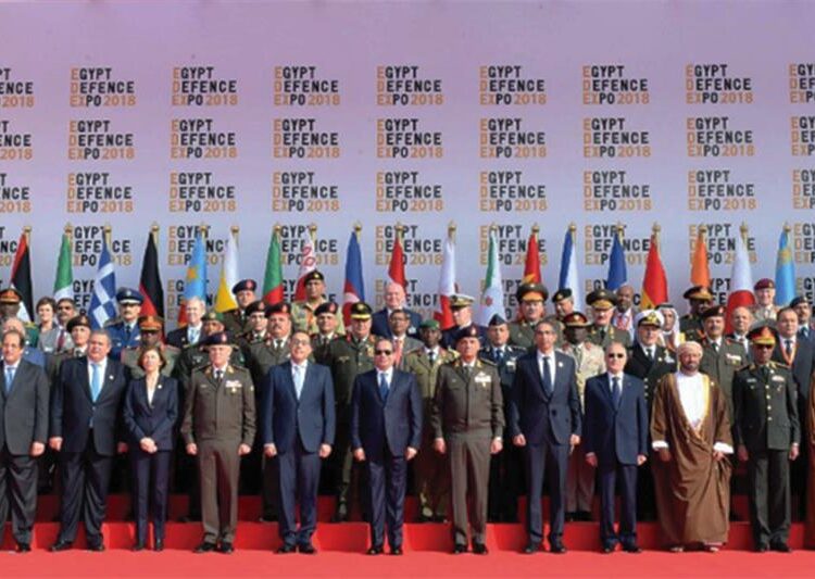Sisi poses for photo with officials at "EDEX 2021" inauguration 1 - Egyptian Gazette Egyptian President Abdel-Fattah El-Sisi with attendants from different countries and companies representatives pose for an image during the inauguration of Egypt Defence Expo on Monday 29 November