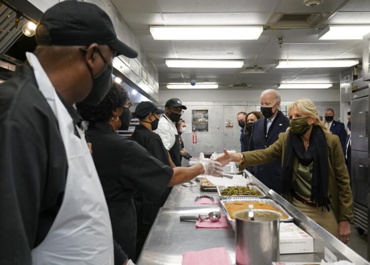 President Joe Biden, first lady Jill Biden, Vice President Kamala Harris, and second gentleman Doug Emhoff, arrive to assemble Thanksgiving meal kits during a visit to DC Central Kitchen in Washington, Tuesday, Nov. 23, 2021.
