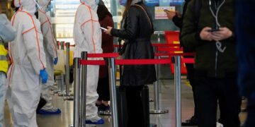 Europe and Asia, alarmed by Covid variant, start to tighten borders