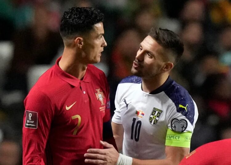 Italy or Portugal to miss 2022 World Cup after play-off draw 1 - Egyptian Gazette Portugal's Cristiano Ronaldo (L) discusses with Serbia's Dusan Tadic during their World Cup 2022 group A qualifying match in Lisbon on Nov. 14, 2021.