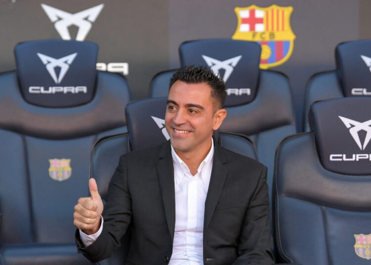Newly-appointed FC Barcelona’s Spanish coach Xavi Hernandez poses for pictures during his presentation ceremony at the Camp Nou stadium in Barcelona, November 8, 2021.