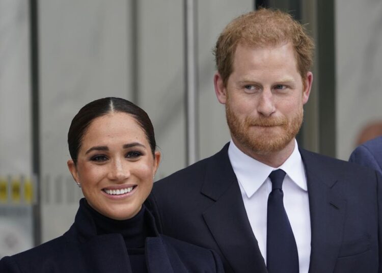 FILE - Meghan Markle and Prince Harry pose for pictures after visiting the observatory in One World Trade in New York, Thursday, Sept. 23, 2021. The Duchess of Sussex on Thursday, Dec. 2, 2021, won the latest stage in her long-running privacy lawsuit against a newspaper publisher over its publication of parts of a letter she wrote to her estranged father. The Court of Appeal in London upheld a High Court ruling in February that publication of the letter that Meghan Markle wrote to her father Thomas Markle after she married Prince Harry in 2018 was unlawful and breached her privacy.