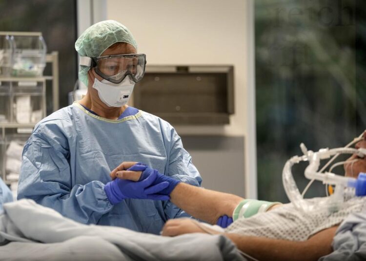 An intubated Covid-19 patient gets treatment at the intensive care unit at the Westerstede Clinical Center, a military-civilian hospital in Westerstede, northwest Germany, Friday, Dec. 17, 2021. As hospitals across Europe brace themselves for a surge in coronavirus cases over the holiday season because of the new omicron variant, Westerstede Clinical Center is cautiously hopeful it can weather the storm.