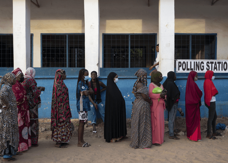 Gambians vote in 1st post-Jammeh presidential election 1 - Egyptian Gazette People line up to cast their ballot for Gambia's presidential elections in Bakau, Gambia, Saturday, Dec. 4, 2021.