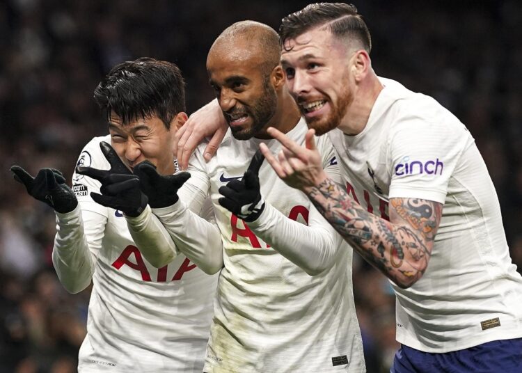 Tottenham Hotspur's Son Heung-min (L) celebrates scoring his side's third goal against Norwich City in London.