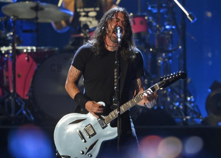 FILE - Dave Grohl performs with the Foo Fighters during the Rock & Roll Hall of Fame induction ceremony, Sunday, Oct. 31, 2021, in Cleveland. The Foo Fighters rock band has called off its concert at the Formula One race in Abu Dhabi due to "unforeseen medical circumstances," event organizers said on Sunday, Dec. 12, 2021.