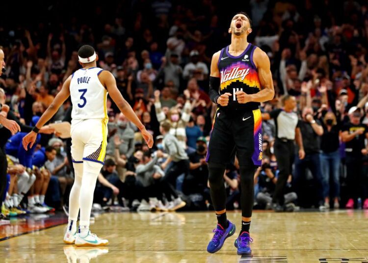 Phoenix Suns guard Landry Shamet (14) reacts during the fourth quarter against the Golden State Warriors at Footprint Centre, Arizona.