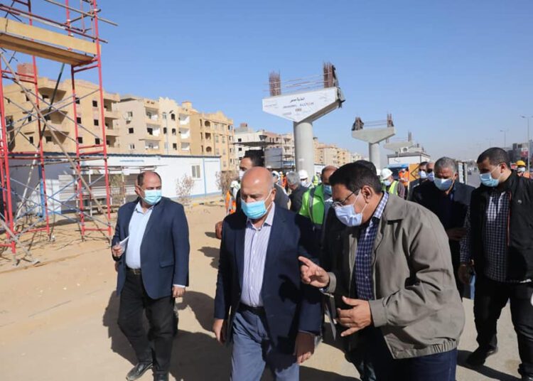 Minister el-Wazir (middle) listening to an explanation from engineers overseeing the implementation of the monorail.