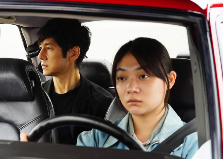 This image released by Janus Films and Sideshow shows Hidetoshi Nishijima, left, and Toko Miura in a scene from "Drive My Car."