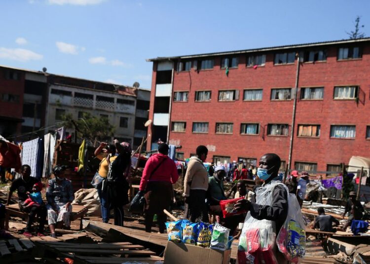 A street vendor wears a mask as he sells goods during the coronavirus disease (COVID-19) outbreak in Harare, Zimbabwe, July 8, 2021.